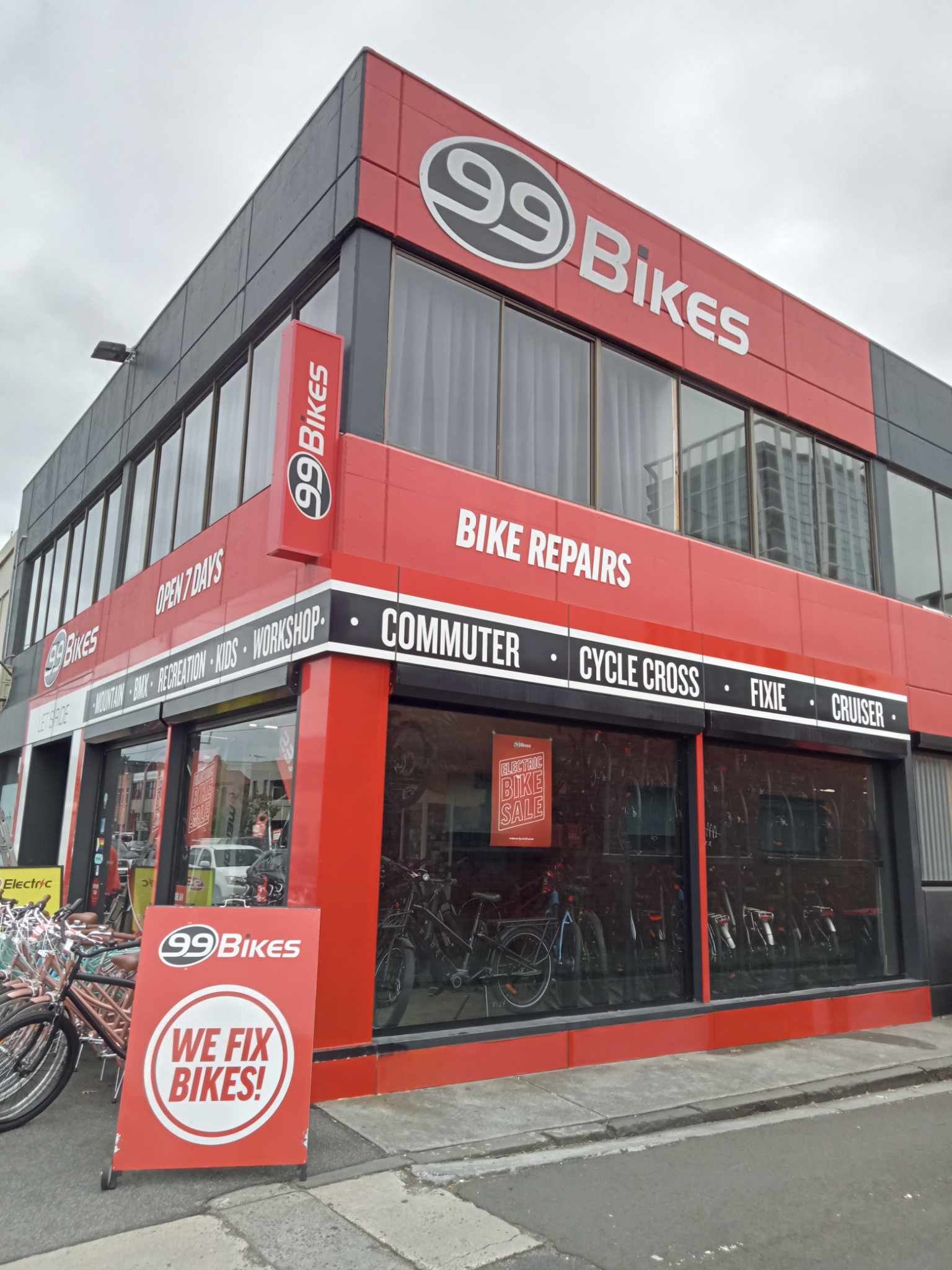 99 Bikes store front with red and gray facade