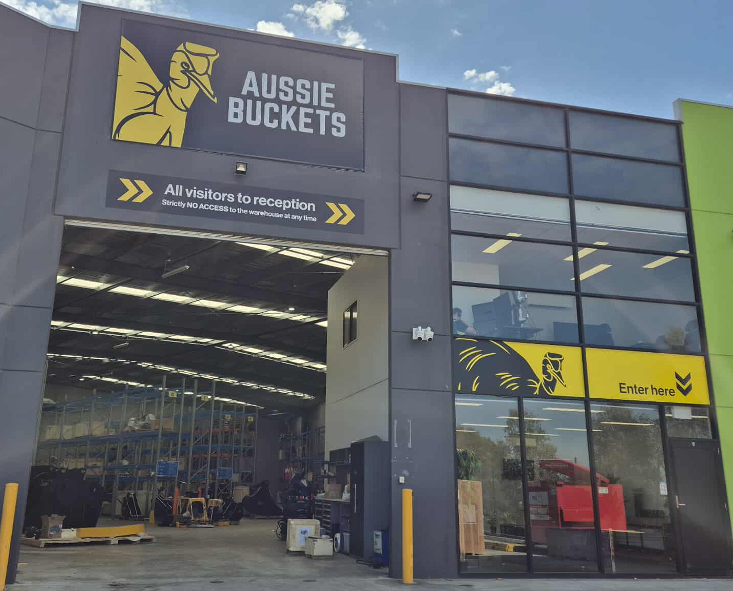 Aussie Buckets store entrance with branding on a clear day