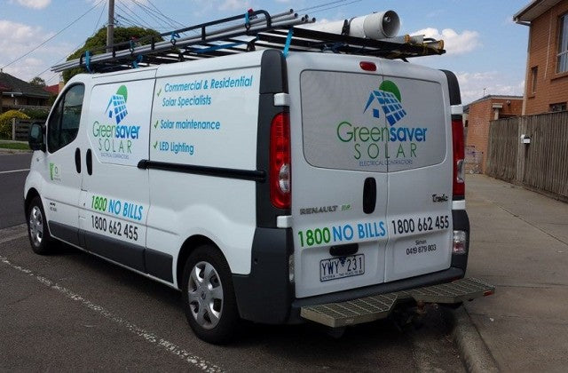 Van with GreenSaver Solar branding on a residential street